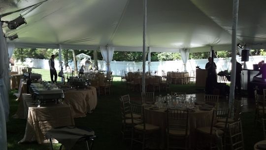 tables set up with pole covers on tent legs